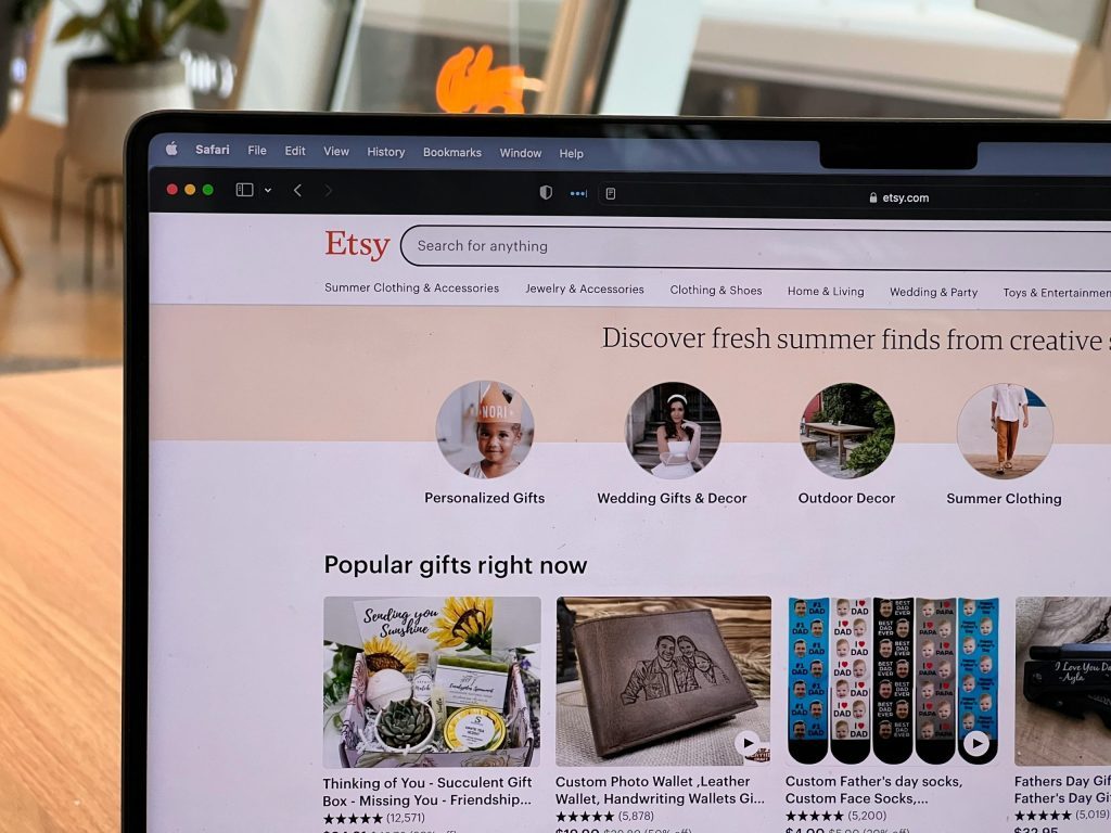 A laptop with the etsy website open.