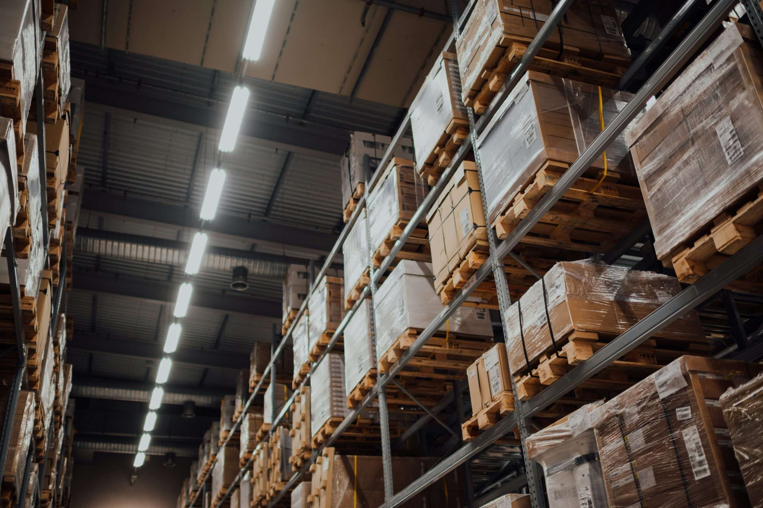 Boxes stacked on shelves in a warehouse.