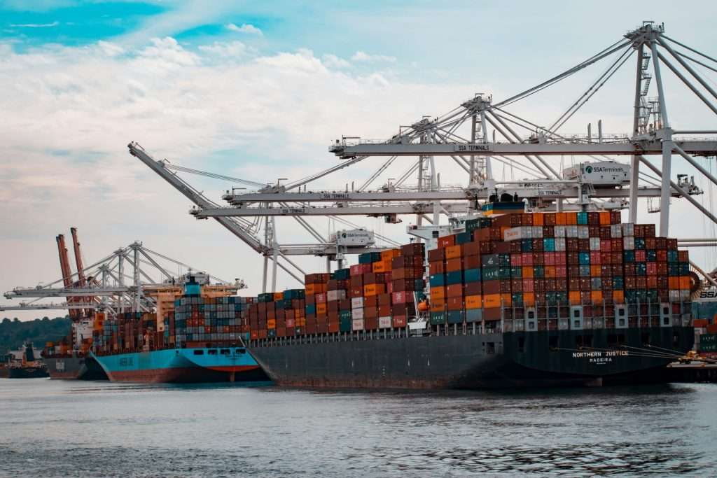 Multiple ships sitting in a dock.