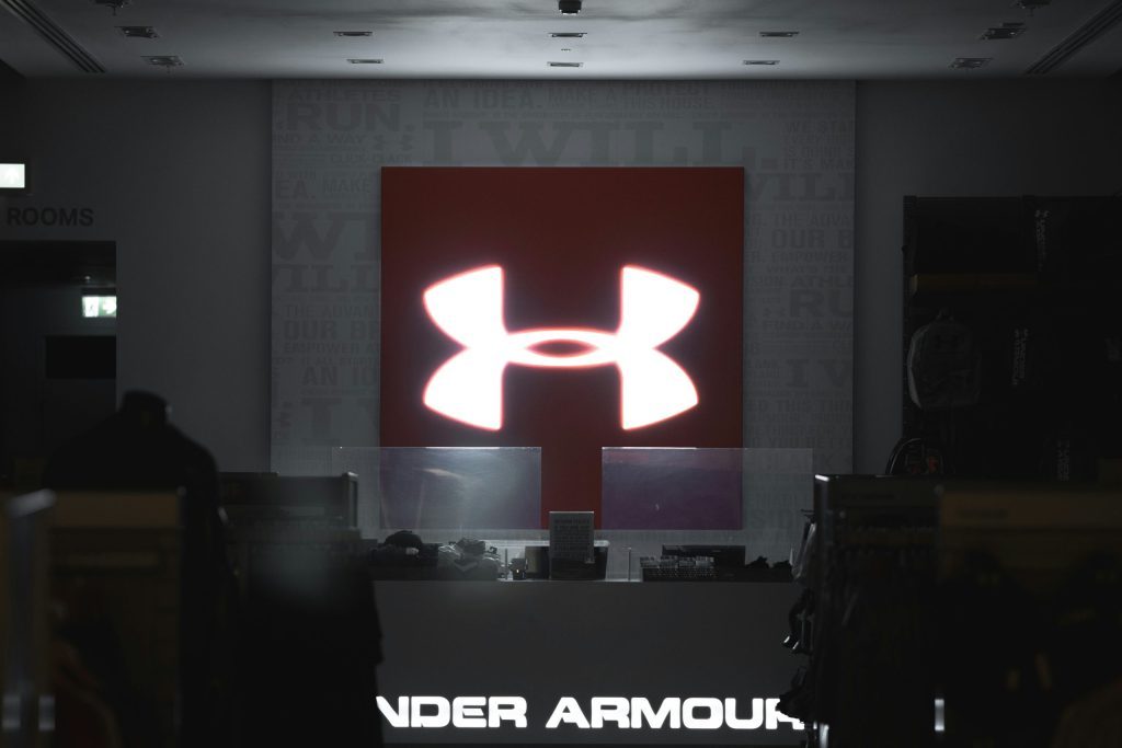 Under armour branding featuring at the front of an under armour conference.