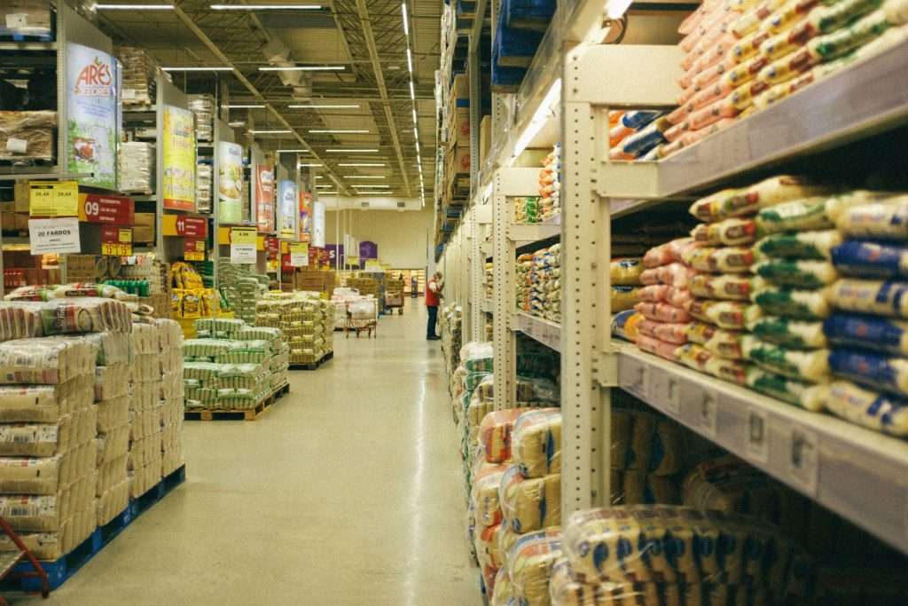 A warehouse with packages lined on shelves.