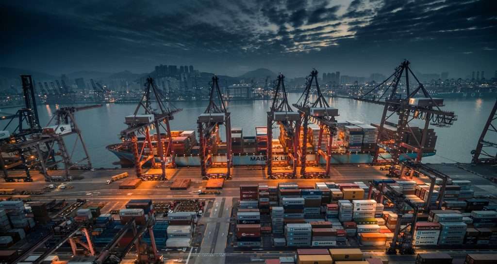 View from within a shipping port seen at night time.