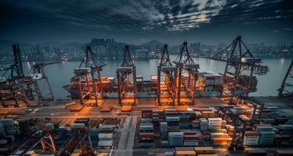 View of a shipping port by night.