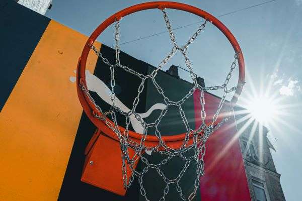 A basketball hoop with the Puma logo painted onto the back.