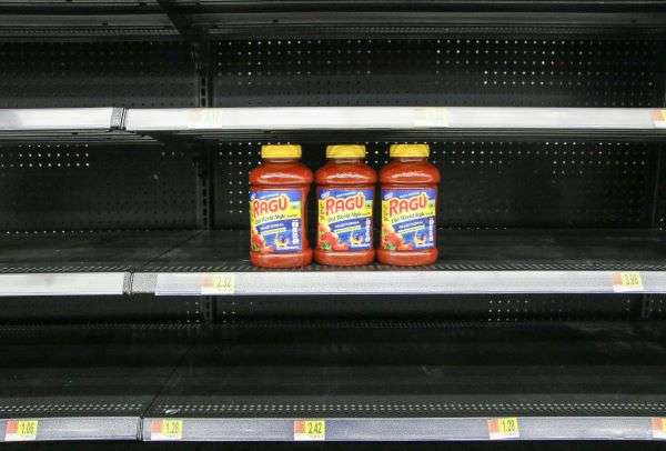 Shelves in a shop empty after stock out and supply chain disruption.