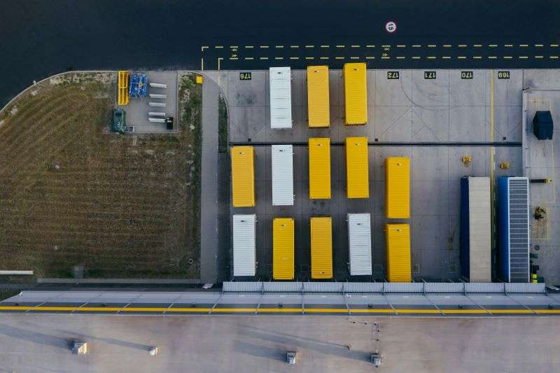 Rows of trailers outside a warehouse.