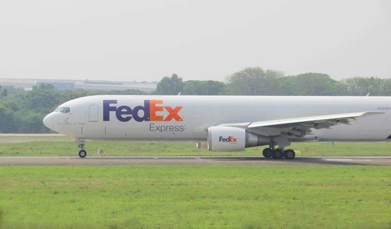 A FedEx plane taking off from an airport runway. The delivery giant is bolstering its FedEx International Connect Plus solution as cross-border demand grows.