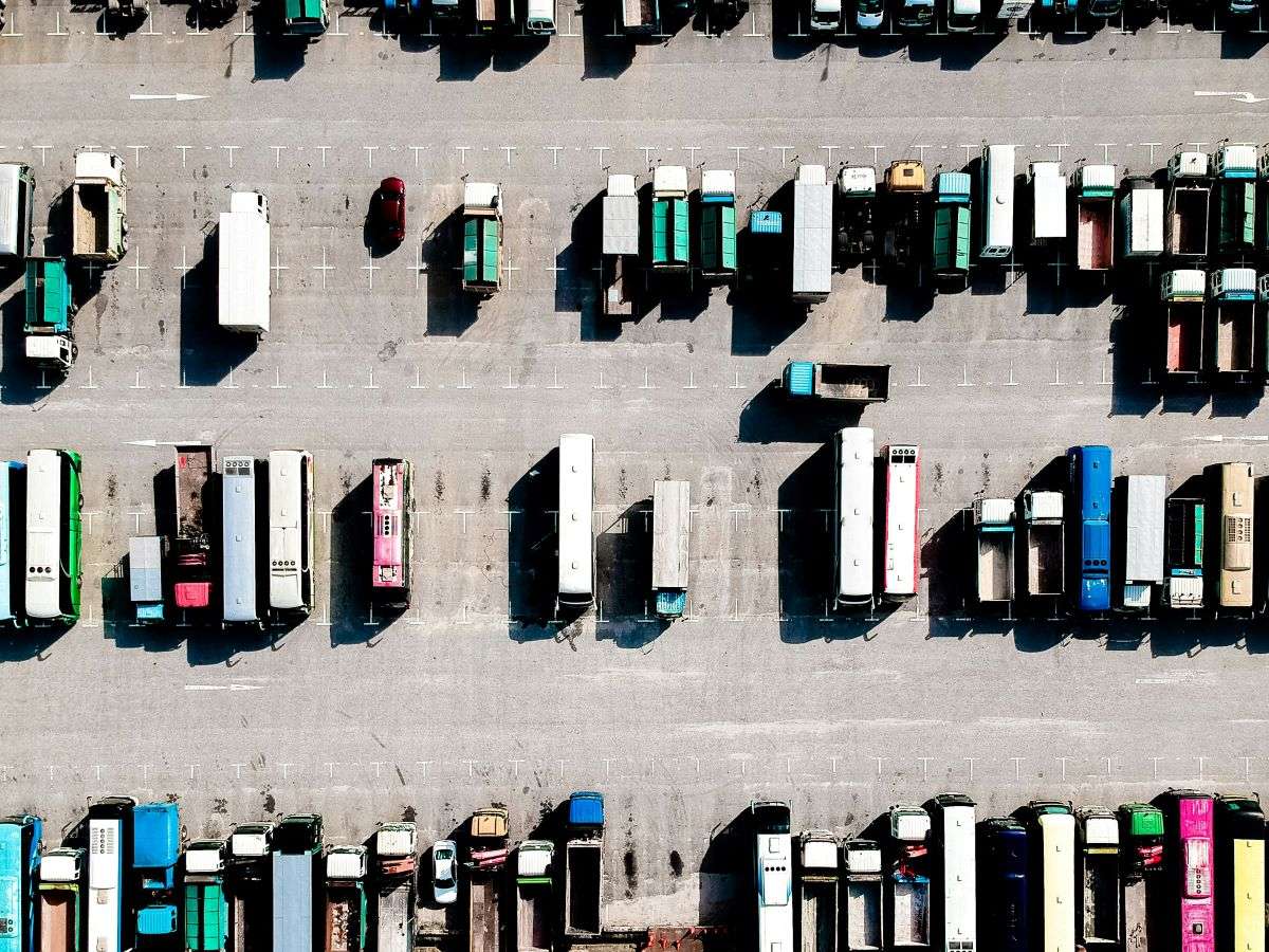 Parked trucks. AI-driven tools optimize logistics, enhancing route planning, sustainability, and personalized customer experiences.