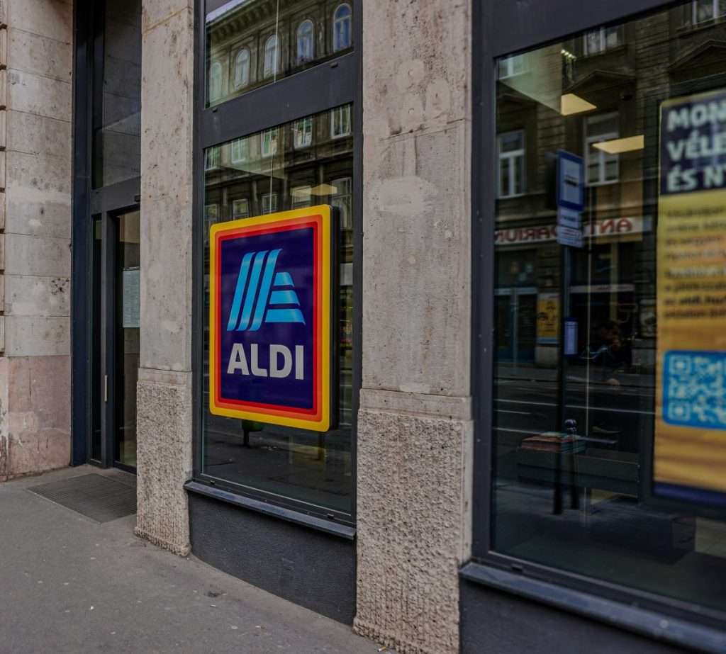 Aldi commits to net-zero emissions by 2050, focusing on supply chain and global operations.